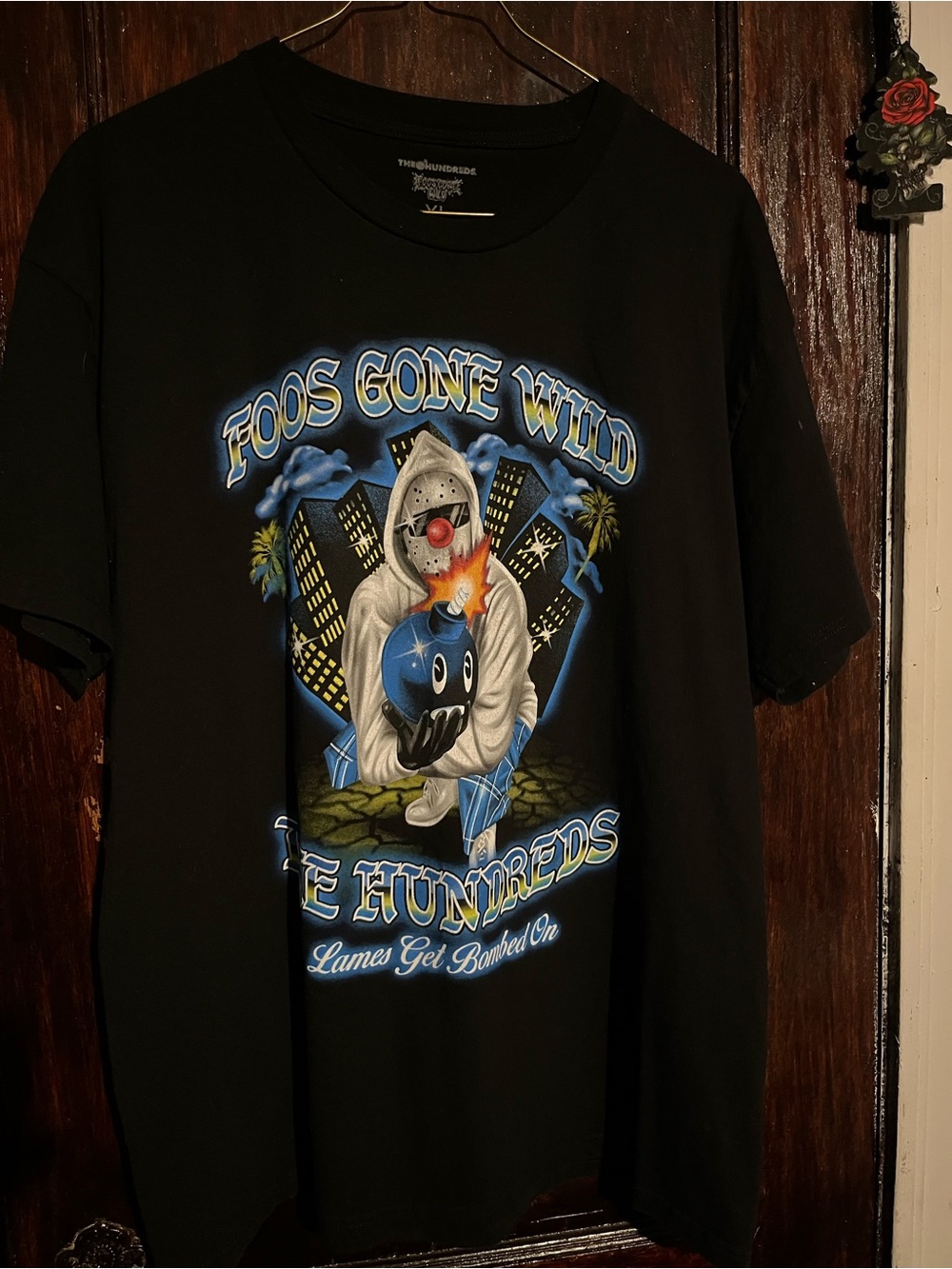 Foos Gone Wild Black Graphic Tee with Blue and White Artwork